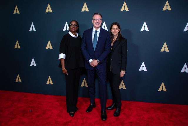 (L/R) Academy Foundation Board President & Nicholl Committee Co-Chair, Kim Taylor-Coleman, Academy of Motion Picture Arts and Sciences CEO Bill Kramer and Nicholl Committee Co-Chair Julie Lynn attend the Academy Nicholl Fellowships in Screenwriting ceremony at the Beverly Hills Hotel in Beverly Hills, California, on April 15, 2026. (Photo by Apu GOMES / AFP)
