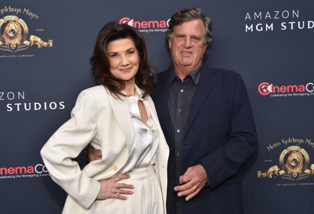 US actress Daphne Zuniga poses with her husband as she promotes the upcoming film “Spaceballs: The New One” during the Amazon MGM Studios photo call during CinemaCon at The Colosseum at Caesars Palace on April 15, 2026 in Las Vegas, Nevada. (Photo by Chris Delmas / AFP)
