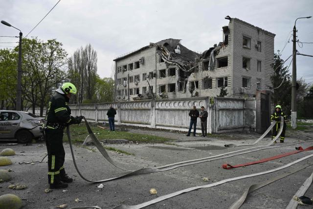 Firefighters work at a site following a Russian strike in Kyiv on April 16, 2026, amid the Russian invasion of Ukraine. Russian strikes killed at least 12 people in Ukraine, local authorities said on April 16, after Moscow pummelled its neighbour in overnight attacks. (Photo by Genya SAVILOV / AFP)