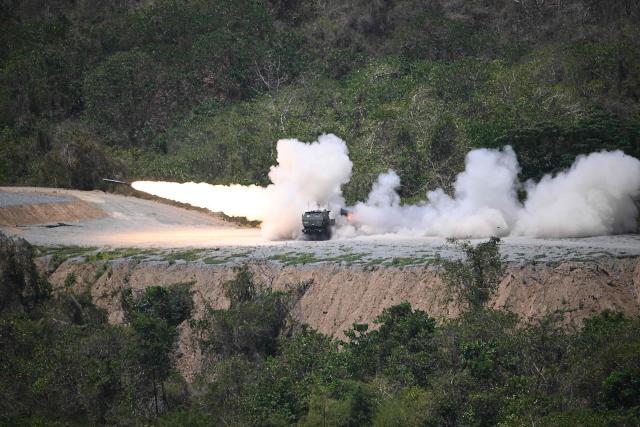 A US army High Mobility Artillery Rocket System (HIMARS) is fired as part of a live fire exercise during a joint army-to-army exercise between the Philippines and the US at Fort Magsaysay, Nueva Ecija province north of Manila on April 16, 2026. (Photo by Ted ALJIBE / AFP)