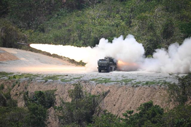 A US army High Mobility Artillery Rocket System (HIMARS) is fired as part of a live fire exercise during a joint army-to-army exercise between the Philippines and the US at Fort Magsaysay, Nueva Ecija province north of Manila on April 16, 2026. (Photo by Ted ALJIBE / AFP)