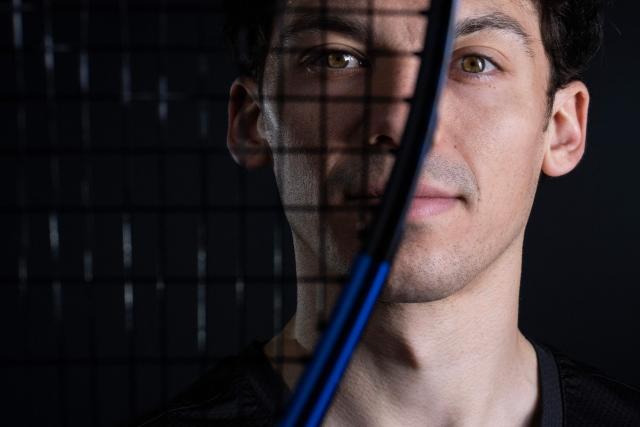 French squash player Victor Crouin poses during a photo session in Paris on April 16, 2026. (Photo by JULIEN DE ROSA / AFP)