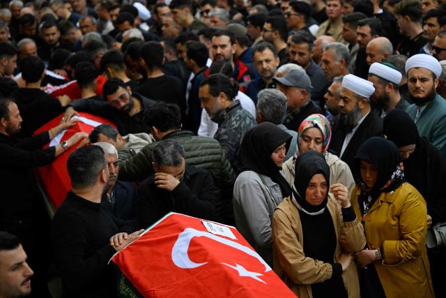 Family members and mourners attend the funerals for nine victims killed in a school shooting by a 14-year-old, an attack that has sent shockwaves across the country, with authorities saying the suspect had referenced a US mass killer in a WhatsApp profile image, in the southern province of Kahramanmaras on April 16, 2026. The funerals take place for eight children aged 10 and 11 and a 55-year-old teacher. (Photo by YASIN AKGUL / AFP)