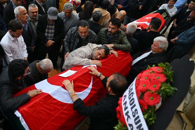 Family members and mourners attend the funerals for nine victims killed in a school shooting by a 14-year-old, an attack that has sent shockwaves across the country, with authorities saying the suspect had referenced a US mass killer in a WhatsApp profile image, in the southern province of Kahramanmaras on April 16, 2026. The funerals take place for eight children aged 10 and 11 and a 55-year-old teacher. (Photo by YASIN AKGUL / AFP)