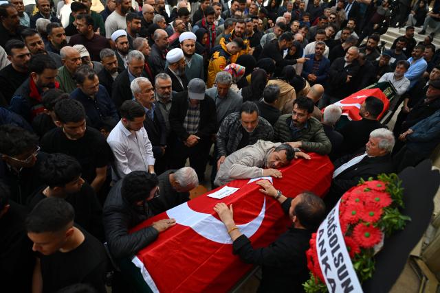 Family members and mourners attend the funerals for nine victims killed in a school shooting by a 14-year-old, an attack that has sent shockwaves across the country, with authorities saying the suspect had referenced a US mass killer in a WhatsApp profile image, in the southern province of Kahramanmaras on April 16, 2026. The funerals take place for eight children aged 10 and 11 and a 55-year-old teacher. (Photo by YASIN AKGUL / AFP)