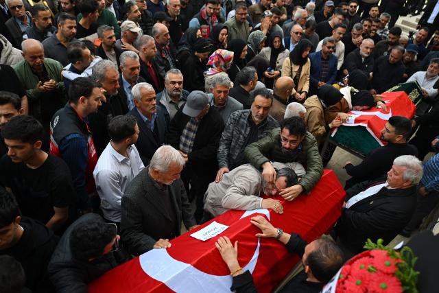Family members and mourners attend the funerals for nine victims killed in a school shooting by a 14-year-old, an attack that has sent shockwaves across the country, with authorities saying the suspect had referenced a US mass killer in a WhatsApp profile image, in the southern province of Kahramanmaras on April 16, 2026. The funerals take place for eight children aged 10 and 11 and a 55-year-old teacher. (Photo by YASIN AKGUL / AFP)