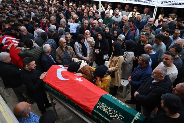 Family members and mourners attend the funerals for nine victims killed in a school shooting by a 14-year-old, an attack that has sent shockwaves across the country, with authorities saying the suspect had referenced a US mass killer in a WhatsApp profile image, in the southern province of Kahramanmaras on April 16, 2026. The funerals take place for eight children aged 10 and 11 and a 55-year-old teacher. (Photo by YASIN AKGUL / AFP)