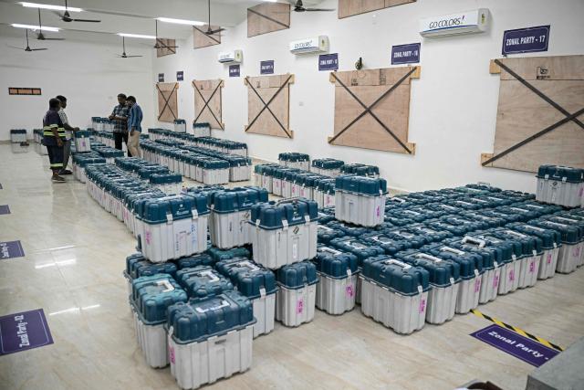 Poll officials arrange the Electronic Voting Machines (EVMs) in a strong room in Chennai on April 16, 2026 ahead of the Tamil Nadu Legislative Assembly election. (Photo by R. Satish BABU / AFP)