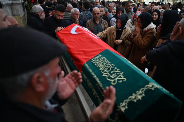 Family members and mourners attend the funerals for nine victims killed in a school shooting by a 14-year-old, an attack that has sent shockwaves across the country, with authorities saying the suspect had referenced a US mass killer in a WhatsApp profile image, in the southern province of Kahramanmaras on April 16, 2026. The funerals take place for eight children aged 10 and 11 and a 55-year-old teacher. (Photo by YASIN AKGUL / AFP)