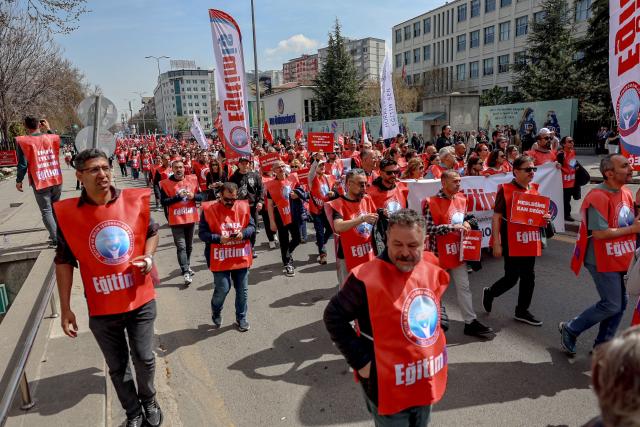 Teachers and members of education unions march during a protest against school shootings in Ankara on April 16, 2026. More than 3,500 teachers from several education unions protested in the Turkish capital Ankara on  following deadly school shootings, calling for the resignation of the education minister. (Photo by ADEM ALTAN / AFP)