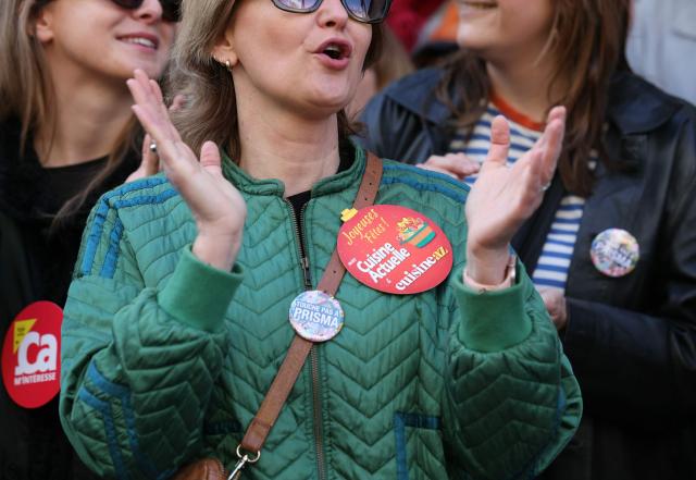 Employees of the leading magazine publisher in France Prisma Group gather during a demonstration against the Employment Protection Plan (PSE) in front of a building of the Prisma Media Group in Paris on April 16, 2026. Prisma Group announced to staff representatives on March 30, 2026 a plan to cut 261 jobs, representing 40% of its workforce, according to the CGT union. (Photo by ALAIN JOCARD / AFP)