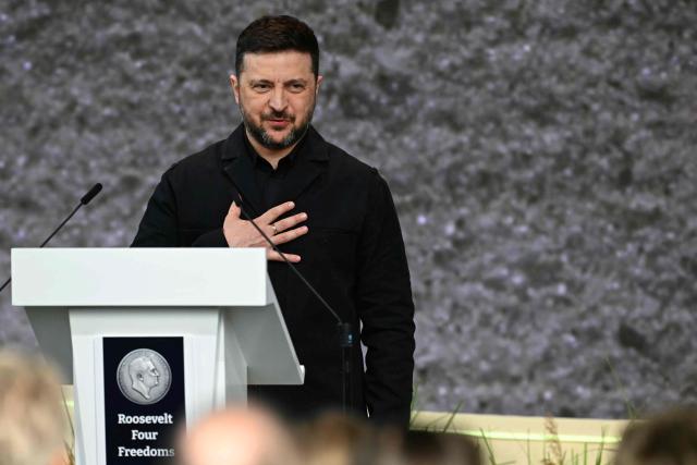 Ukraine's President Volodymyr Zelensky thanks attendees after receiving the International Four Freedoms Award during the Roosevelt Foundation's International Four Freedoms Awards ceremony in Middelburg on April 16, 2026. (Photo by NICOLAS TUCAT / AFP)