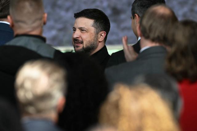 Ukraine's President Volodymyr Zelensky thanks attendees after receiving the International Four Freedoms Award during the Roosevelt Foundation's International Four Freedoms Awards ceremony in Middelburg on April 16, 2026. (Photo by NICOLAS TUCAT / AFP)