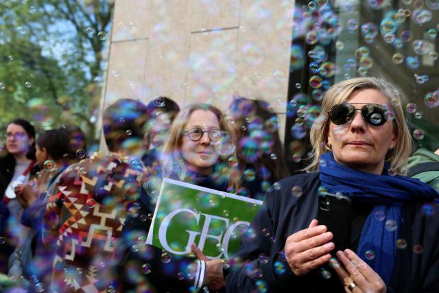 Employees of the leading magazine publisher in France Prisma Group gather during a demonstration against the Employment Protection Plan (PSE) in front of a building of the Prisma Media Group in Paris on April 16, 2026. Prisma Group announced to staff representatives on March 30, 2026 a plan to cut 261 jobs, representing 40% of its workforce, according to the CGT union. (Photo by Alain JOCARD / AFP)