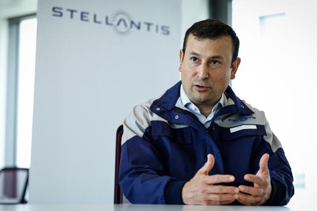Éric Haan, director of the Stellantis Poissy plant addresses media during a press conference at the Stellantis multinational car manufacturer's plant in Poissy, west of Paris on April 16, 2026. Automaker Stellantis will cease automobile production at its historic Poissy plant (Yvelines) after 2028. The site will be converted into a parts manufacturing and vehicle dismantling center, retaining 1,000 of the current 2,000 jobs, the group announced on April 16, 2026. (Photo by Simon Wohlfahrt / AFP)