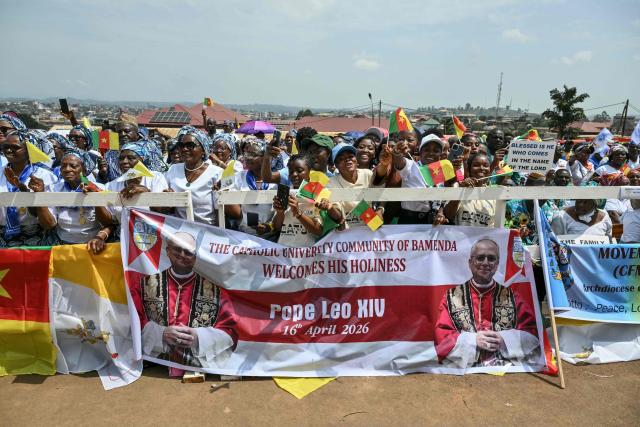 Supporters of Pope Leo XIV cheer as they wait for his arrival at Saint Joseph's Cathedral in Bamenda, on the fourth day of an 11-day apostolic journey to Africa, on April 16, 2026. (Photo by Alberto PIZZOLI / AFP)