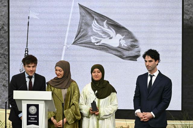 (From L) David Roos, Selma Boulmalf, Oumaima al Abdellaoui and Boaz Cahn, initiators of the Dutch initiative for interreligious dialogue Deel de Duif (Share the dove of peace), deliver a speech as they receive the Youth for Freedom award during the Roosevelt Foundation's International Four Freedoms Awards ceremony in Middelburg on April 16, 2026. (Photo by NICOLAS TUCAT / AFP)