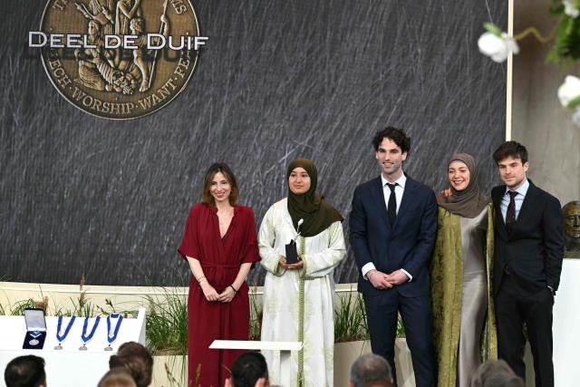 (From R) David Roos, Selma Boulmalf, Boaz Cahn and Oumaima al Abdellaoui, initiators of the Dutch initiative for interreligious dialogue Deel de Duif (Share the dove of peace), receive from the hand of Dutch author and documentary filmmaker Natascha van Weezel (L) the Youth for Freedom award during the Roosevelt Foundation's International Four Freedoms Awards ceremony in Middelburg on April 16, 2026. (Photo by NICOLAS TUCAT / AFP)