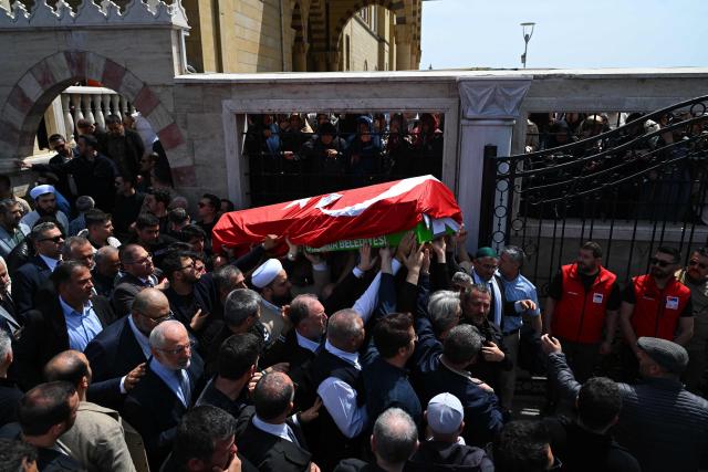 Family members and mourners attend the funerals for nine victims killed in a school shooting by a 14-year-old, an attack that has sent shockwaves across the country, with authorities saying the suspect had referenced a US mass killer in a WhatsApp profile image, at the Abdulhamid Han Mosque in the southern province of Kahramanmaras on April 16, 2026. The funerals take place for eight children aged 10 and 11 and a 55-year-old teacher. (Photo by YASIN AKGUL / AFP)