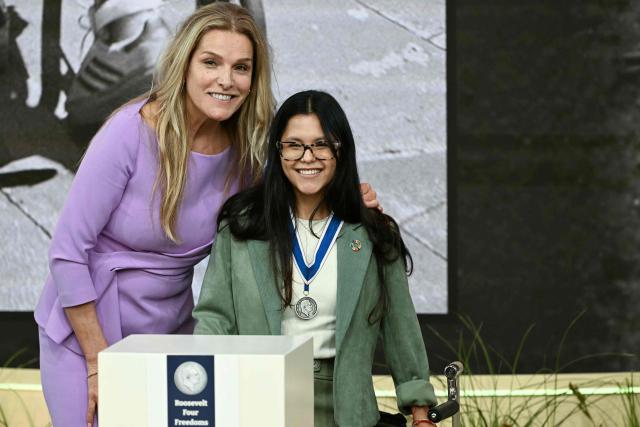 Chilean activist for the rights of people with disabilities Isidora Uribe Silva receives from the hand of Dutch television presenter and politician Lucille Werner (L) the Freedom From Want award during the Roosevelt Foundation's International Four Freedoms Awards ceremony in Middelburg on April 16, 2026. (Photo by NICOLAS TUCAT / AFP)