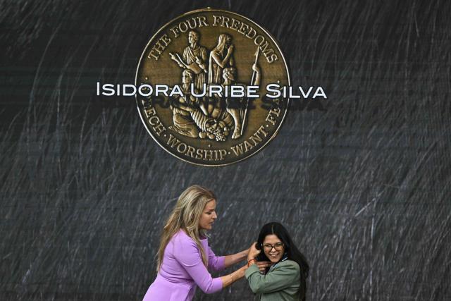 Chilean activist for the rights of people with disabilities Isidora Uribe Silva receives from the hand of Dutch television presenter and politician Lucille Werner (L) the Freedom From Want award during the Roosevelt Foundation's International Four Freedoms Awards ceremony in Middelburg on April 16, 2026. (Photo by NICOLAS TUCAT / AFP)