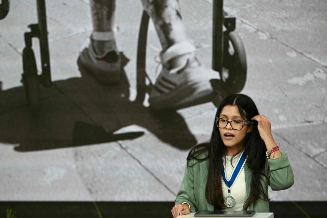 Chilean activist for the rights of people with disabilities Isidora Uribe Silva delivers a speech after receiving the Freedom From Want award during the Roosevelt Foundation's International Four Freedoms Awards ceremony in Middelburg on April 16, 2026. (Photo by NICOLAS TUCAT / AFP)