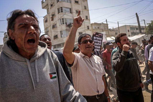 Demonstrators march to mark Palestinian Prisoner's Day during a protest against recently-approved Israeli law allowing the execution of Palestinians convicted on terror charges for deadly attacks, in Khan Younis on April 16, 2026. Under the new law, passed in parliament late on March 30, Palestinians in the West Bank convicted by military courts of carrying out deadly attacks classified as "terrorism" will face the death penalty as a default sentence. Because Palestinians in the territory are automatically tried in Israeli military courts, the measure effectively creates a separate and harsher legal track. (Photo by BASHAR TALEB / AFP)
