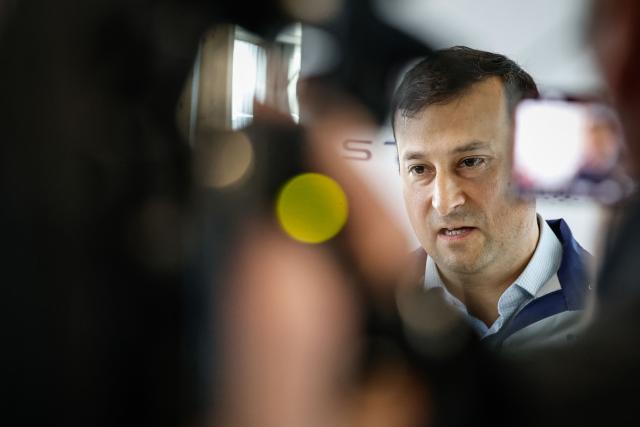 Director of the Stellantis Poissy plant Éric Haan addresses media during a press conference at the Stellantis multinational car manufacturer's plant in Poissy, west of Paris on April 16, 2026. Automaker Stellantis will cease automobile production at its historic Poissy plant (Yvelines) after 2028. The site will be converted into a parts manufacturing and vehicle dismantling center, retaining 1,000 of the current 2,000 jobs, the group announced on April 16, 2026. (Photo by Simon Wohlfahrt / AFP)