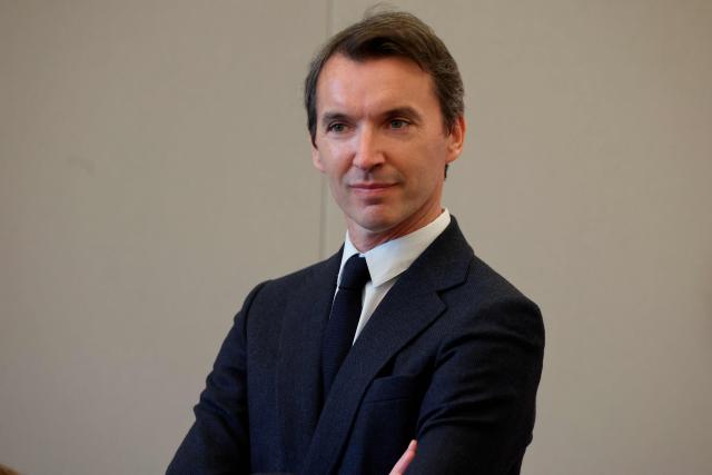 Clement Hervieu-Leger, head of the Comedie-Francaise, looks on during a visit to the International City of French Language (Cite Internationale de la Langue Francaise) to promote 'disconnecting' and 'reading' as alternatives to screens as part of his fight to ban social networks for the youngest in the castle of Villers-Cotterets, northern France on April 16, 2026. In response to the explosion in screen time among 6- to 17-year-olds and the impact of algorithms on our children, Emmanuel Macron has pledged to ban social media for those under 15. (Photo by Ludovic MARIN / POOL / AFP)