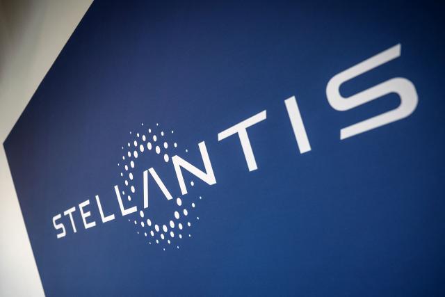 This photograph shows the Stellantis logo at the Stellantis multinational car manufacturer's plant in Poissy, west of Paris on April 16, 2026. Automaker Stellantis will cease automobile production at its historic Poissy plant (Yvelines) after 2028. The site will be converted into a parts manufacturing and vehicle dismantling center, retaining 1,000 of the current 2,000 jobs, the group announced on April 16, 2026. (Photo by Simon Wohlfahrt / AFP)