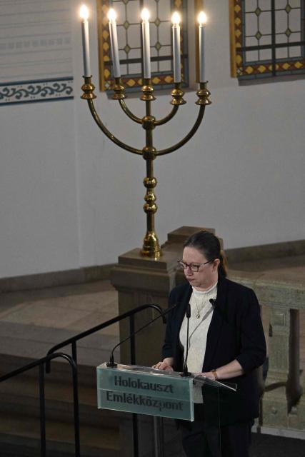 Israel's ambassador to Hungary Maya Kadosh delivers her speech as members of the local Jewish community and diplomats participate on a commemoration ceremony for Hungarian Holocaust victims at the Holocaust Memorial Center in Budapest, Hungary on April 16, 2026. April 16, 2026 marks the 82th anniversary of the beginning of the Hungarian Holocaust during which some 600,000 Jewish Hungarians were deported to Nazi death camps in Austria, Germany and Poland. The Memorial Day of the Hungarian Victims of the Holocaust was established by the Ministry of Education in 2000 and is commemorated in schools, at memorial sites and by Jewish communities throughout the country. (Photo by Attila KISBENEDEK / AFP)