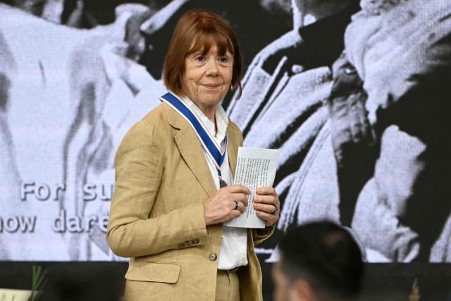Frenchwoman Gisèle Pelicot, whose husband was convicted in 2024 of drugging her and letting scores of men rape her while unconscious, thanks attendees after receiving the Freedom from Fear award during the Roosevelt Foundation's International Four Freedoms Awards ceremony in Middelburg on April 16, 2026. (Photo by NICOLAS TUCAT / AFP)