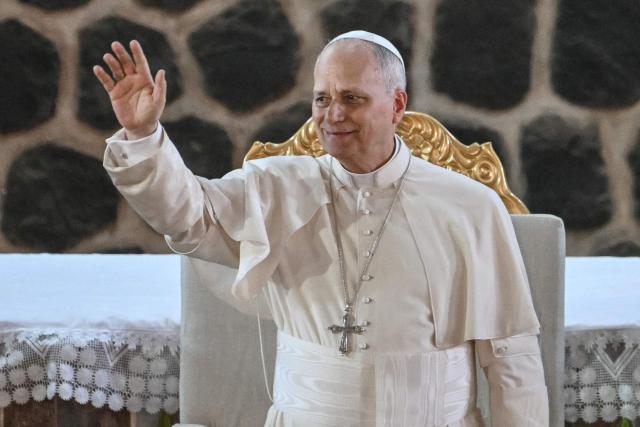 Pope Leo XIV waves as he arrives at Saint Joseph's Cathedral in Bamenda, on the fourth day of an 11-day apostolic journey to Africa, on April 16, 2026. (Photo by Alberto PIZZOLI / AFP)