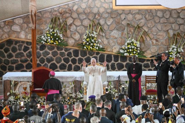 Pope Leo XIV raises his hands as he arrives at Saint Joseph's Cathedral in Bamenda, on the fourth day of an 11-day apostolic journey to Africa, on April 16, 2026. (Photo by Alberto PIZZOLI / AFP)