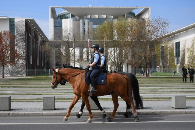 Police officers are pictured on horse prior an official visit of Ireland's Prime Minister at the Chancellery in Berlin on April 16, 2026. (Photo by RALF HIRSCHBERGER / AFP)