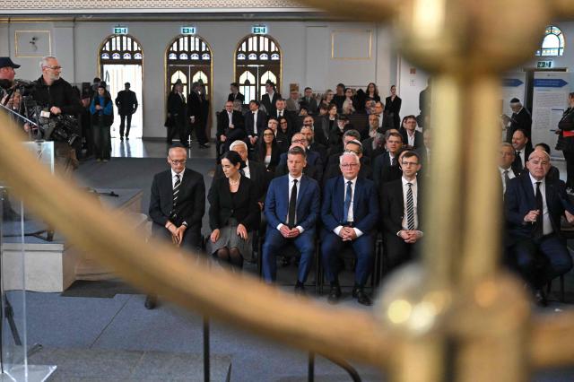 Hungary's Prime minister-elect Peter Magyar (3rdL) attends a commemoration ceremony to mark the 82th anniversary of Hungarian Holocaust victims at the Holocaust Memorial Center in Budapest, Hungary on April 16, 2026. April 16, 2026 marks the 82th anniversary of the beginning of the Hungarian Holocaust during which some 600,000 Jewish Hungarians were deported to Nazi death camps in Austria, Germany and Poland. The Memorial Day of the Hungarian Victims of the Holocaust was established by the Ministry of Education in 2000 and is commemorated in schools, at memorial sites and by Jewish communities throughout the country. (Photo by Attila KISBENEDEK / AFP)