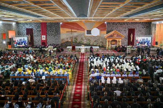 Pope Leo XIV (C) meets with the community of Bamenda at Saint Joseph's Cathedral in Bamenda, on the fourth day of an 11-day apostolic journey to Africa, on April 16, 2026. (Photo by Alberto PIZZOLI / AFP)