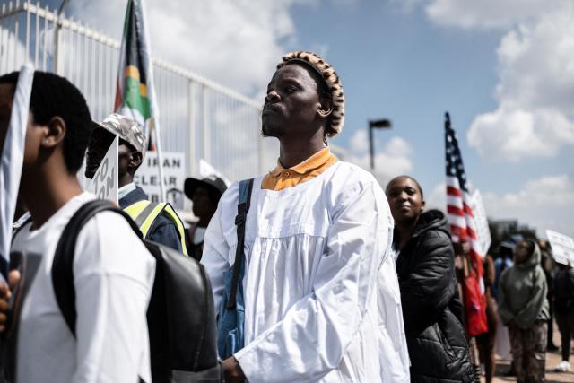 A member of Shembe Nazareth Baptist Church stands during a protest in front of the US Consulate in Sandton, on April 16, 2026. (Photo by ILARIA FINIZIO / AFP)