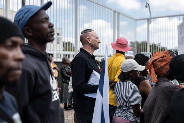 Protesters who are pro-democracy for Iran protest in front of the US Consulate in Sandton, on April 16, 2026. (Photo by ILARIA FINIZIO / AFP)