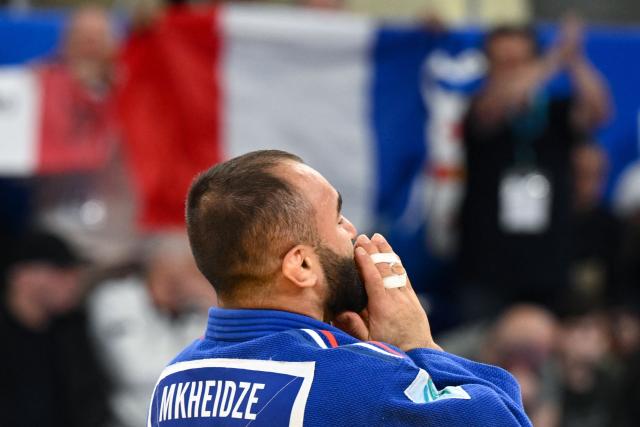 France's Luka Mkheidze wins against Georgia's Giorgi Sardalashvili in the men's under 60 kg category gold medal bout at the Judo European Senior Championships 2026 in Tbilisi on April 16, 2026. (Photo by Vano SHLAMOV / AFP)