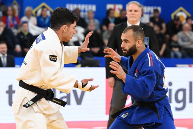 Georgia's Giorgi Sardalashvili (white) and France's Luka Mkheidze compete in the men's under 60 kg category gold medal bout at the Judo European Senior Championships 2026 in Tbilisi on April 16, 2026. (Photo by Vano SHLAMOV / AFP)