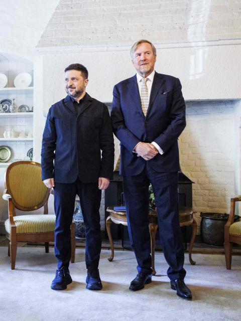 Dutch King Willem-Alexander (R) welcomes Ukrainian President Volodymyr Zelensky following the presentation of the Four Freedoms Awards at the Abbey in Middelburg on April 16, 2026. (Photo by Robin VAN LONKHUIJSEN / ANP / AFP) / Netherlands OUT