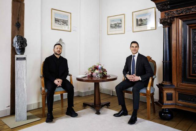 Prime Minister Rob Jetten (R) poses with Ukrainian President Volodymyr Zelensky ahead of their meeting following the presentation of the Four Freedoms Awards at the Abbey in Middelburg on April 16, 2026. (Photo by Robin VAN LONKHUIJSEN / ANP / AFP) / Netherlands OUT