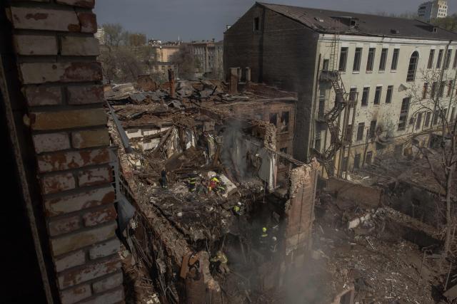 Ukrainian rescuers work at the site of heavily damaged buildings following a Russian air attack in Dnipro, on April 16, 2026, amid the Russian invasion of Ukraine. Massive Russian strikes on Ukraine left at least 19 people dead overnight from April 15 to April 16, particularly in Kyiv and Odesa, Ukrainian authorities said on April 16, 2026, describing these attacks as among the deadliest in recent weeks. (Photo by Roman PILIPEY / AFP)