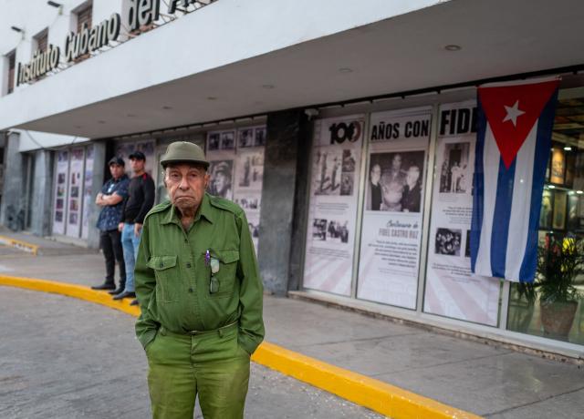 A militia veteran attends celebrations marking the victory on the 65th anniversary of the Bay of Pigs invasion and the declaration of the socialist character of the Cuban Revolution in Havana on April 16, 2026. Between April 15 and 19, 1961, some 1,400 anti-Castro fighters trained and financed by the CIA attempted to land at the Bay of Pigs, about 250 kilometers south of Havana, but failed to overthrow the communist regime of Fidel Castro. (Photo by ADALBERTO ROQUE / AFP)