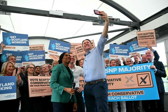 Britain's main opposition Conservative Party leader Kemi Badenoch poses for a selfie photograph with Scottish Conservative leader Russell Findlay during a rally in Edinburgh, Scotland on April 16, 2026, to highlight the importance of voting in upcoming elections. (Photo by ANDY BUCHANAN / AFP)