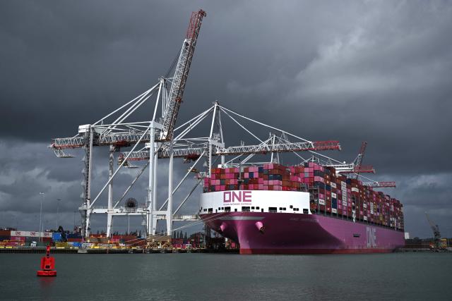 The One Inspiration cargo ship, registered under the flag of Liberia, is seen during loading at the container terminal of Southampton Docks in Southampton on the south coast of England on April 16, 2026. Britain's economy grew much stronger than expected in February, prior to the start of the Middle East war, official data showed on April 16, ahead of a likely hit from the US-Iran conflict. UK gross domestic product growth climbed to 0.5 percent in February compared with expansion of 0.1 percent in January, the Office for National Statistics said in a statement. (Photo by Ben STANSALL / AFP)