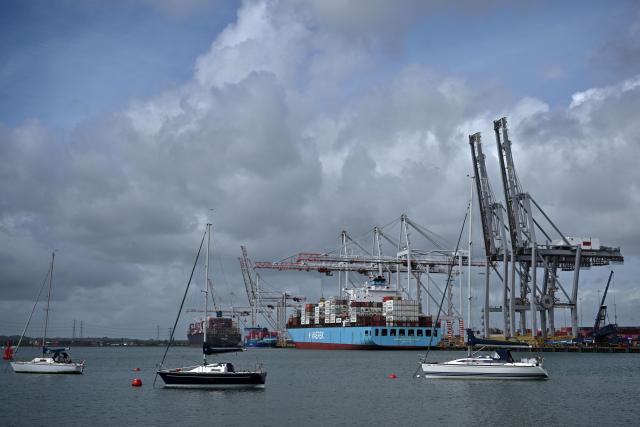 The Maersk Monte Olivia container ship, registered under the flag of Singapore is seen docked at the container terminal of Southampton Docks in Southampton on the south coast of England on April 16, 2026. Britain's economy grew much stronger than expected in February, prior to the start of the Middle East war, official data showed on April 16, ahead of a likely hit from the US-Iran conflict. UK gross domestic product growth climbed to 0.5 percent in February compared with expansion of 0.1 percent in January, the Office for National Statistics said in a statement. (Photo by Ben STANSALL / AFP)