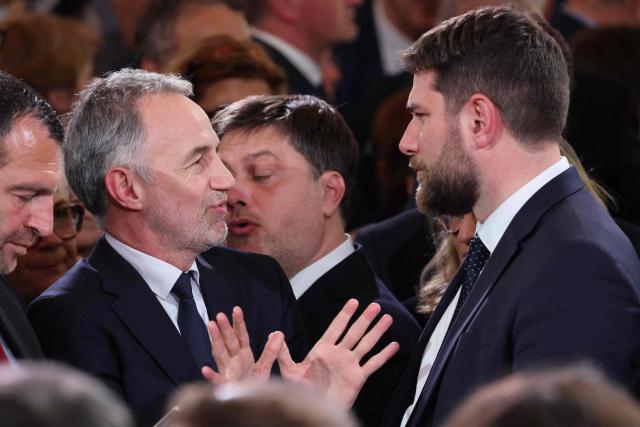 Paris' mayor Emmanuel Grégoire (L) speaks with France's Housing Minister Vincent Jeanbrun during a reception organized for 500 mayors from across the political spectrum and from every part of the country, to 'support' and 'mobilize' these 'alveoli of the nation's democratic lungs', one month after France's municipal elections at the presidential Elysee Palace in Paris on April 16, 2026. (Photo by Ludovic MARIN / POOL / AFP)
