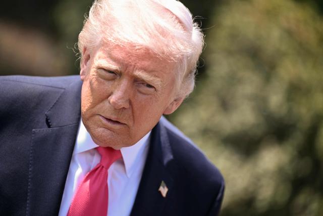 US President Donald Trump speaks to the press before departing from the South Lawn of the White House in Washington, DC, on April 16, 2026. Trump is headed to Las Vegas where he will deliver remarks on his "no tax on tips" policy. (Photo by Brendan SMIALOWSKI / AFP)